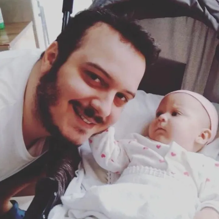 Breno lying next to his baby niece